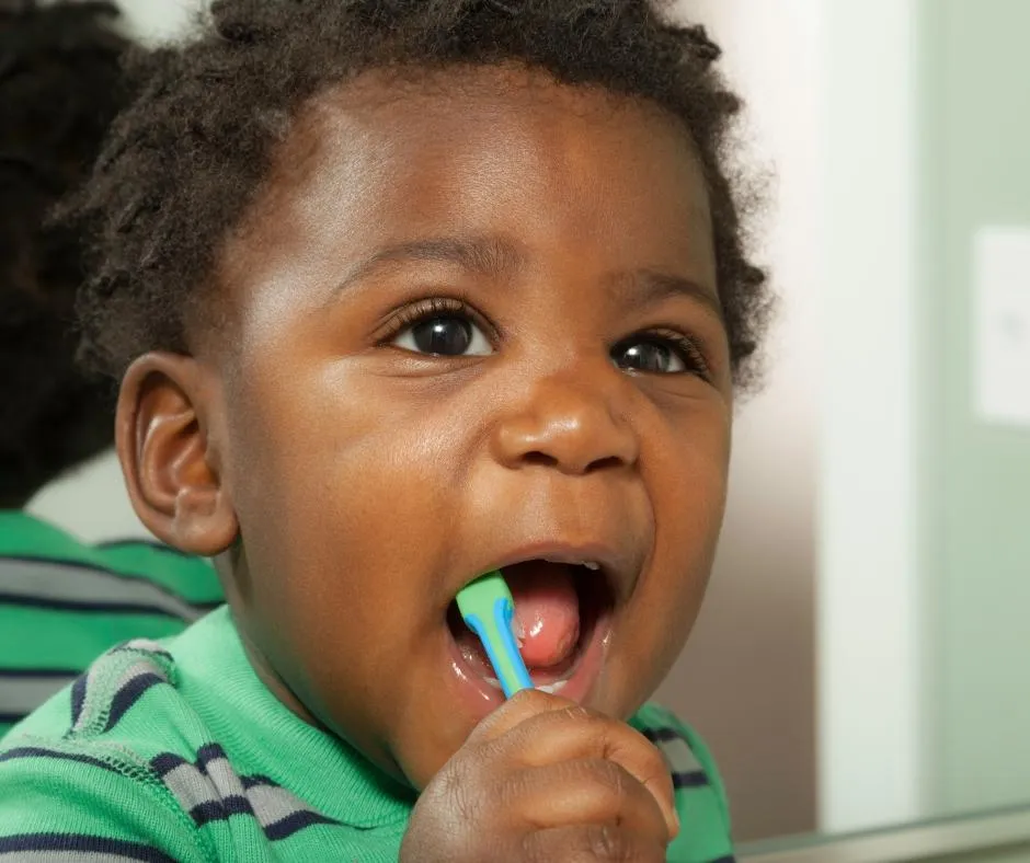 a child brushing his teeth