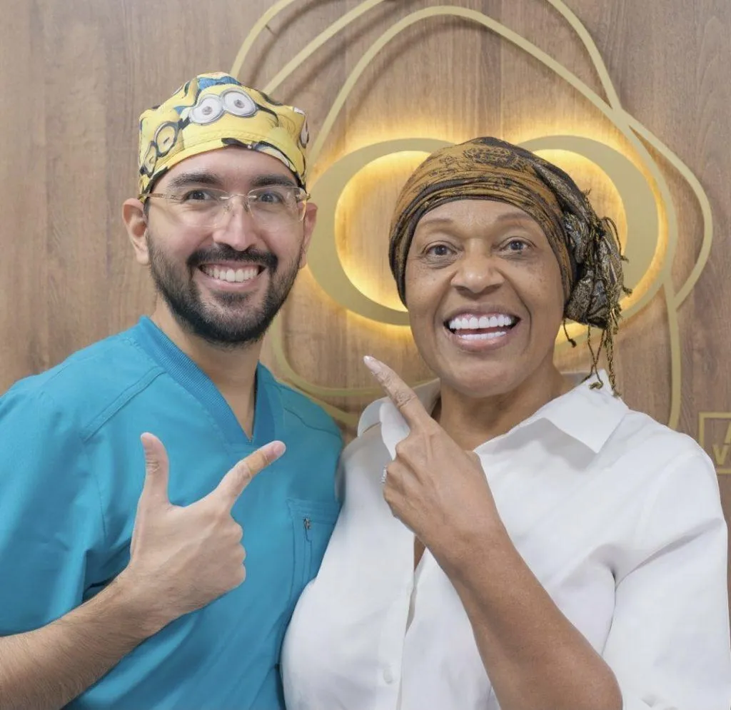 Happy dental patient in Cali, Colombia, smiling after veneers procedure