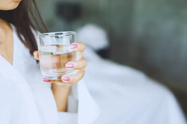 Woman drinking glass of water