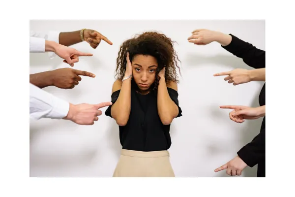 woman with fingers pointing at her