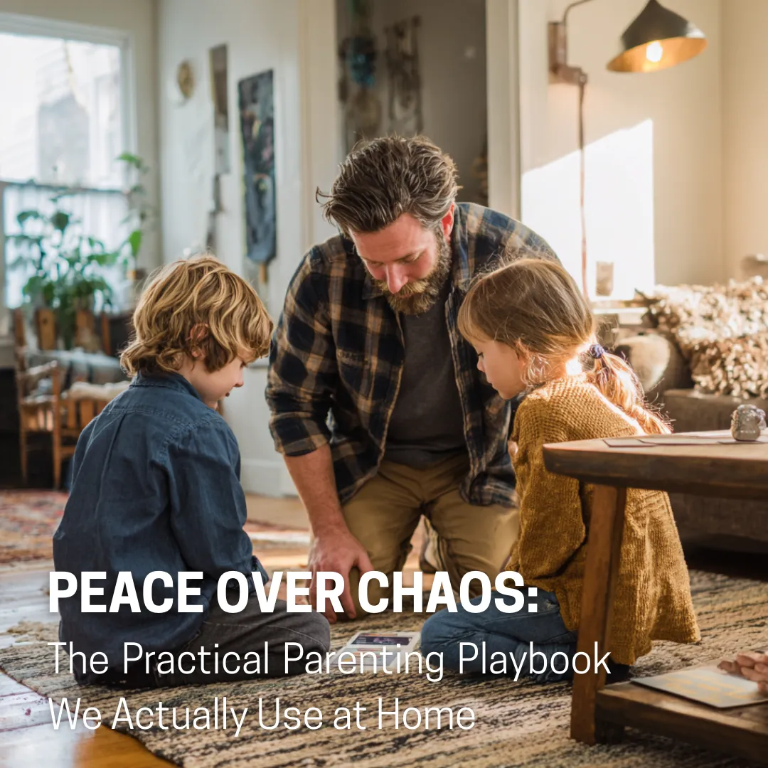 A father kneels at kid-height in a sunlit living room, guiding a calm repair conversation while a verse card sits on the table.