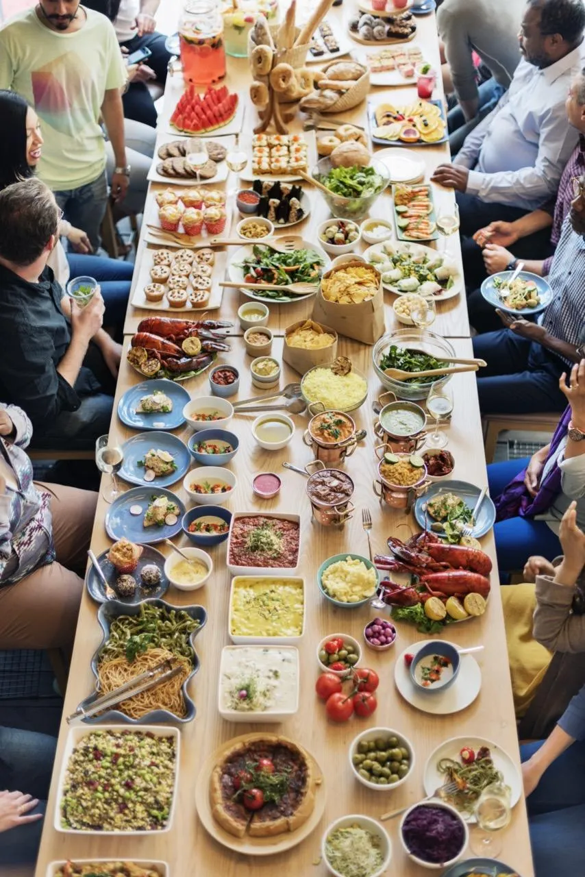 Shores Kitchen Santa Monica- large table with many food and people sitting around