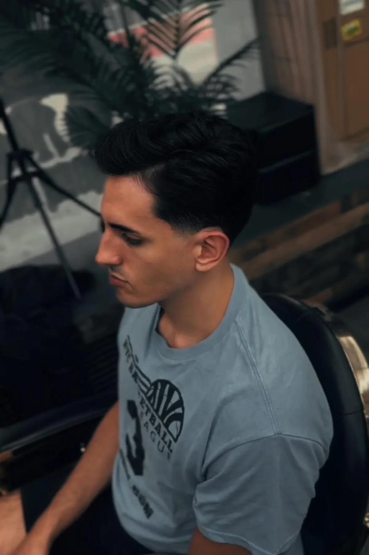 Professional barber giving a men's haircut at Classic Barbershop 2 NYC