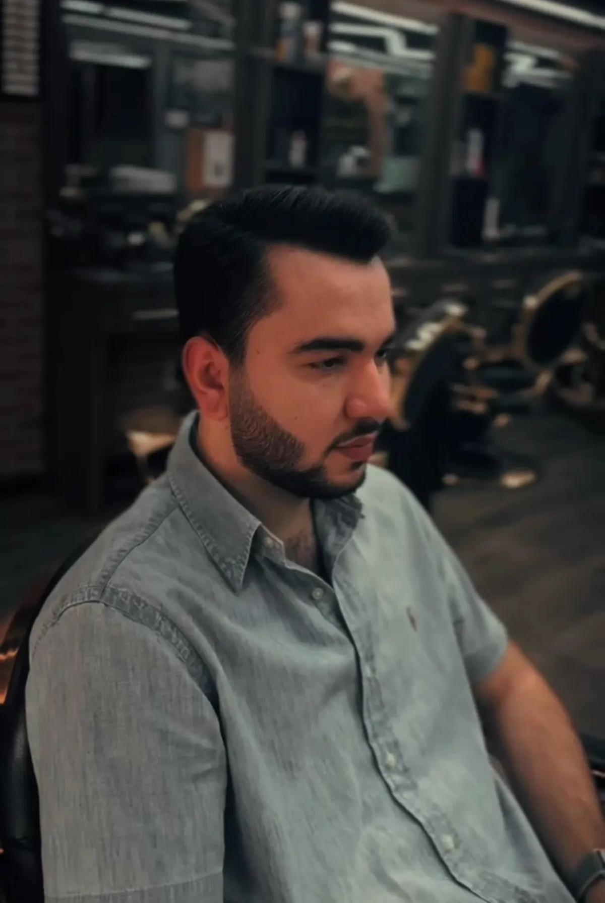 NYC barber grooming a client’s beard at Classic Barbershop 4