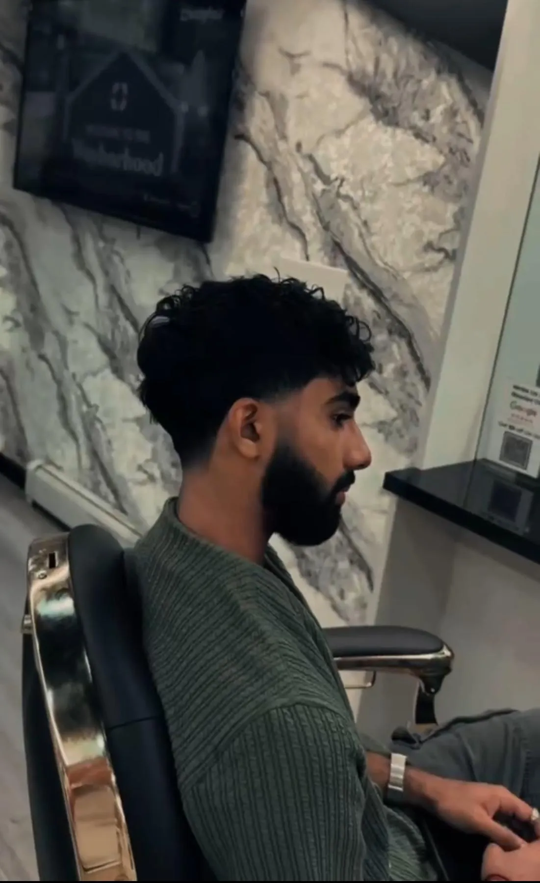 Barber performing a hot towel straight razor shave at Classic Barbershop NYC