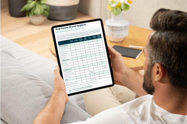 Real Estate Agent looking at article on ipad