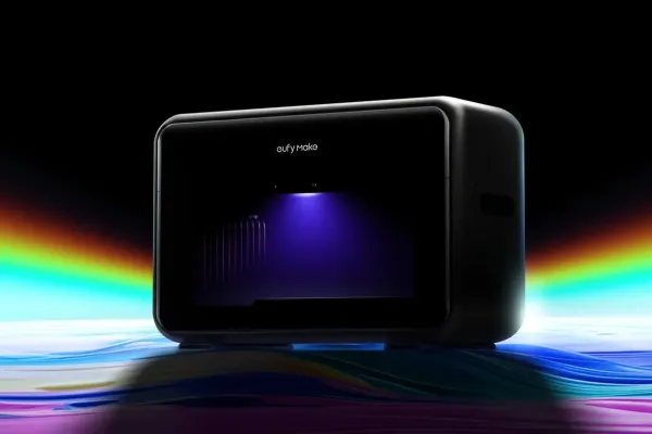 Close-up of the EufyMake UV Printer E1 with a colorful, rainbow gradient backdrop, printing a detailed and textured design