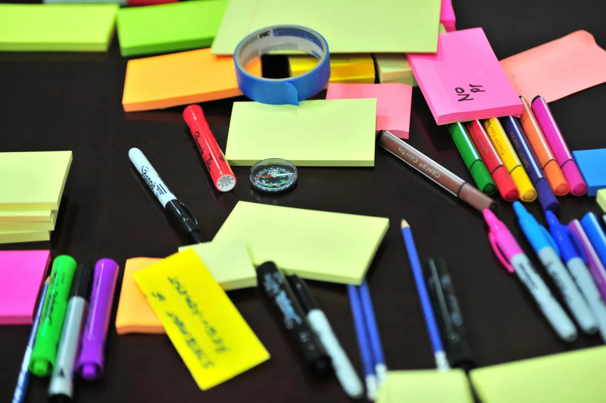 Colorful sticky notes, and pens; photo by Frans van Heerden, from Pexels