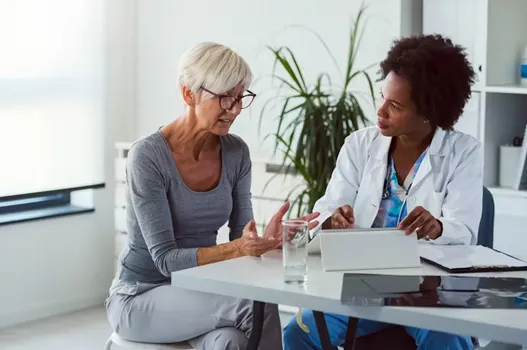 Woman speaking to her doctor about health care 