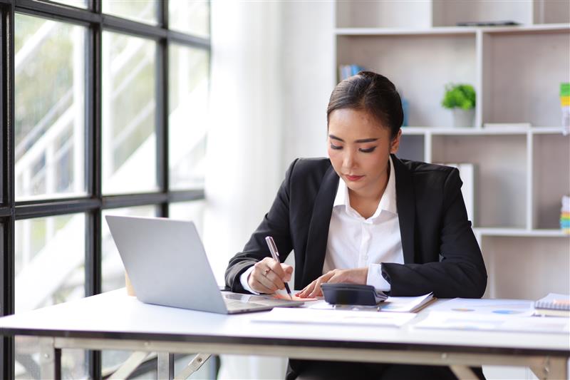 A person using a laptop at home.