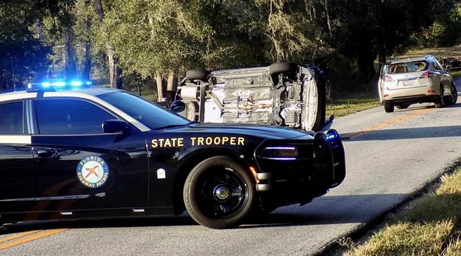 A car accident scene with a police vehicle. Untreated sleep apnea can increase the risk of drowsy driving and accidents.