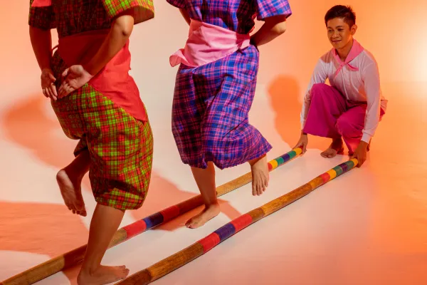 Image of people interacting in a Filipino business setting or a traditional Filipino cultural event