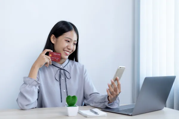 Image of a person managing an online store on a laptop, with a background of Asian cityscapes or online shoppers.