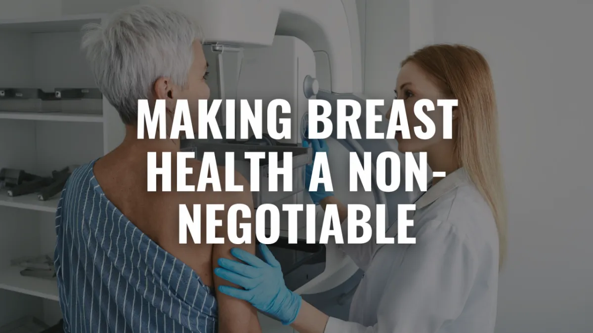 Woman performing breast self-examination in black top demonstrating proper technique for early breast cancer detection