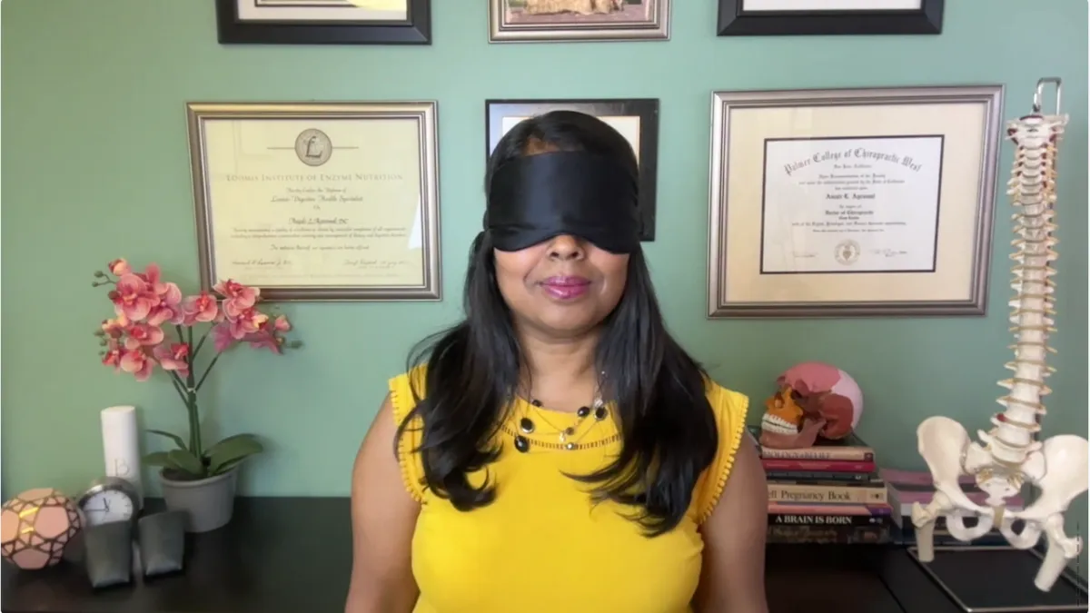Dr. Anjali Agrawal with a sleep mask on to talk about sleep tips