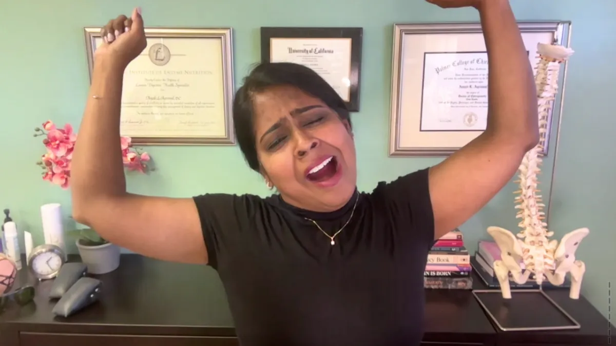 Dr. Anjali doing a big stretch while yawning