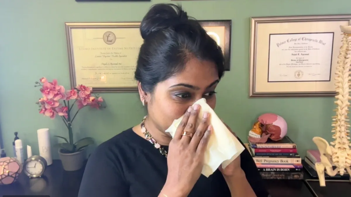 Dr. Anjali blowing her nose as if sick