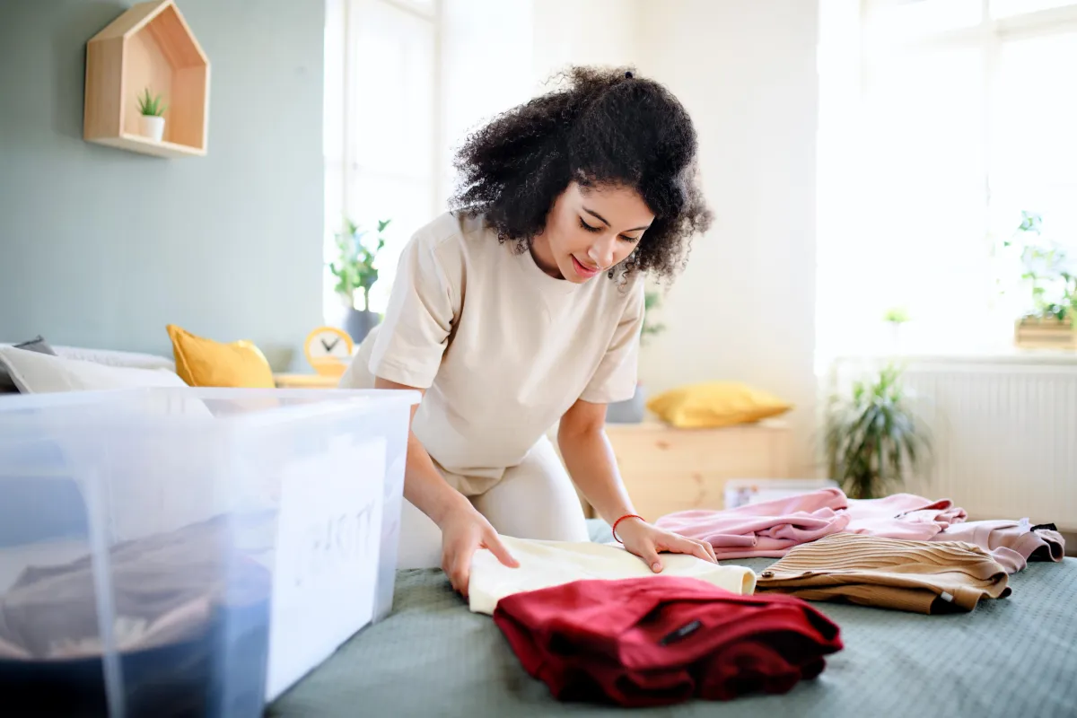 Lady decluttering before moving