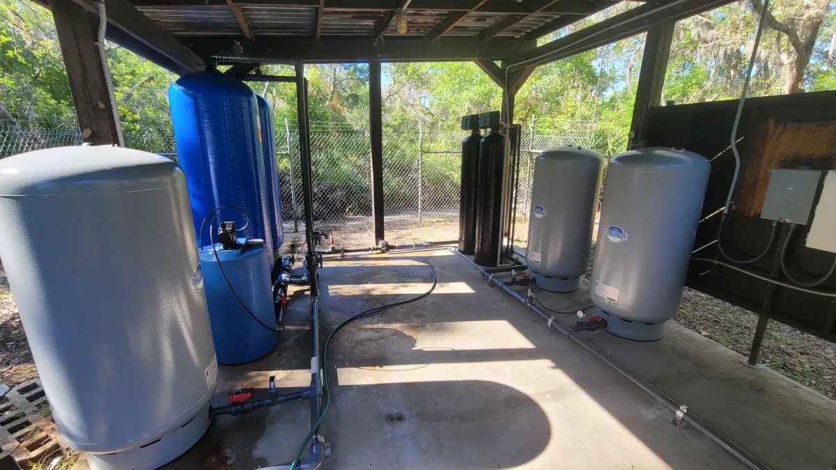 Carver Water technicians repairing Trout Creek Park water system with new tanks, piping, and controls after Hurricane Milton.
