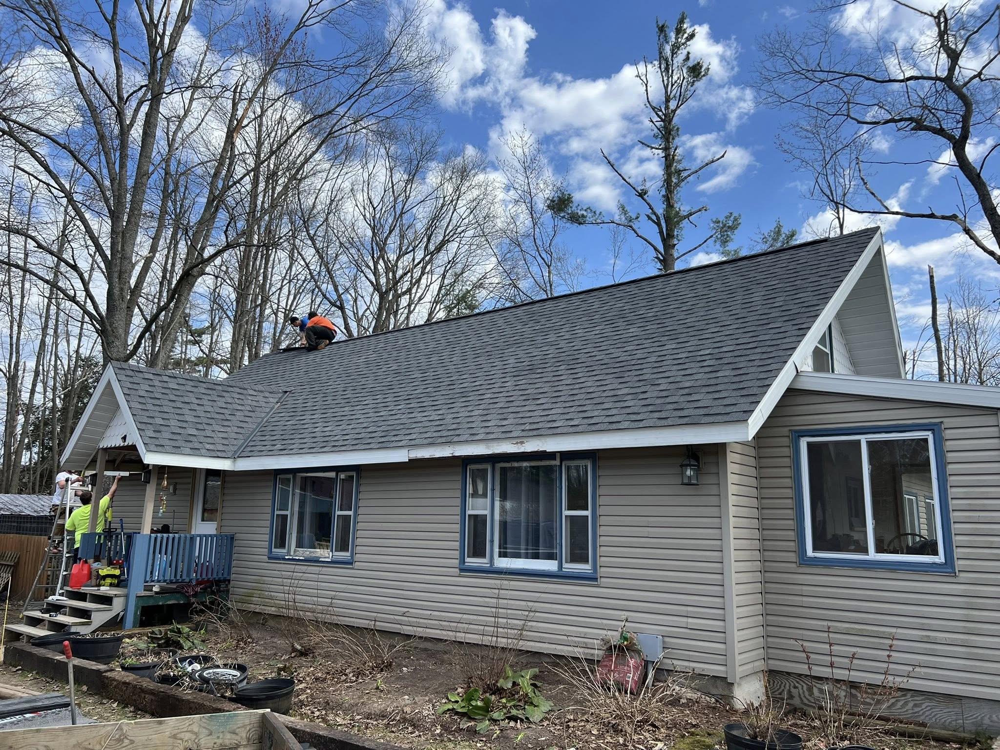 Pitched roof with shingles being repaired