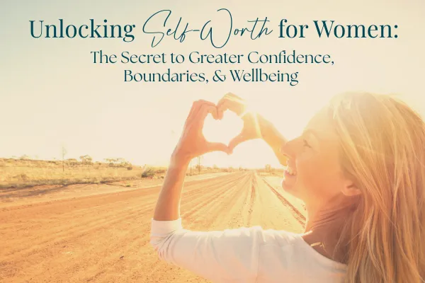 A woman making a heart with her hands because she knows her self-worth