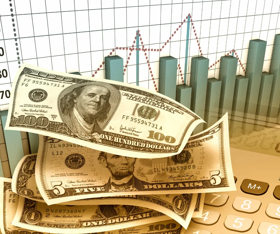 Pile of money in front of a bar graph
