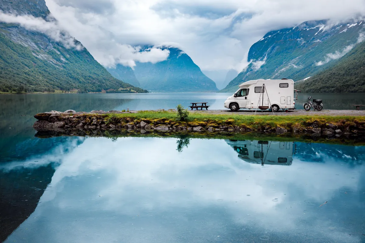 RV parked in the wilderness near a lake