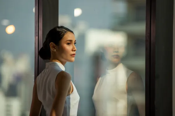 woman looking out of the window