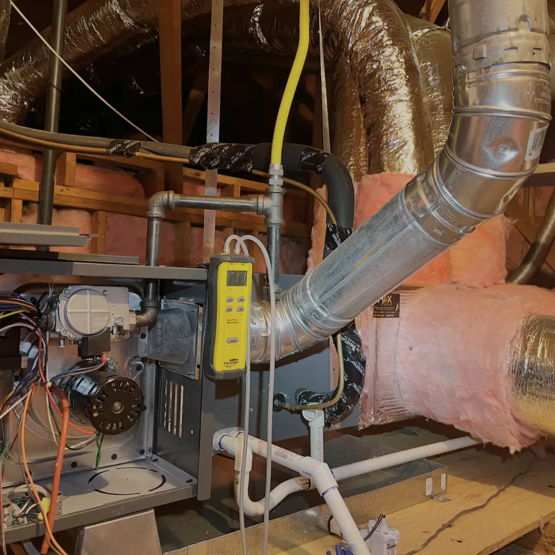 High-efficiency furnace installation in a Lakewood home featuring insulated duct connections for energy savings and reliable heating.