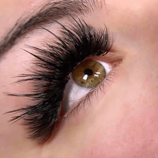 Close-up volume lash set on hazel eye — Lashes by Saby