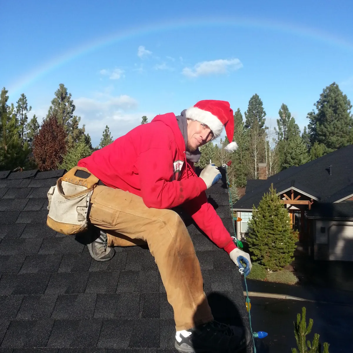 A person troubleshooting Christmas lights, surrounded by festive decorations and holiday lights.