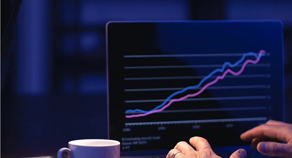 Business growth chart with a person analyzing data.