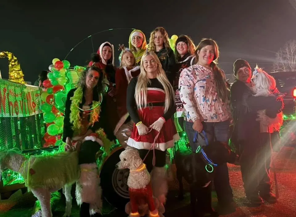 The Turquoise Pooch Paw Spa Team posing for a group picture for the Harrison, Arkansas Christmas parade