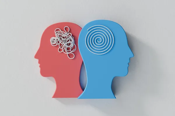 Two head silhouettes, one red with tangled lines representing confusion or stress, and one blue with a clear spiral representing calm and organized thought