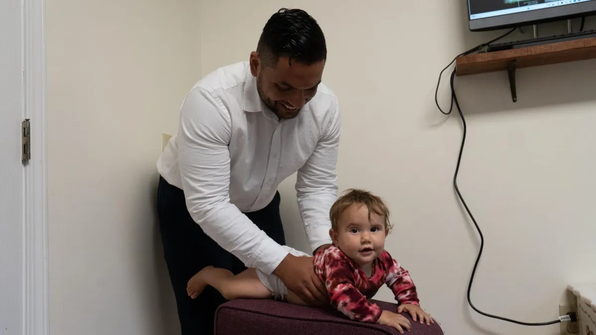 Dr. Thomas adjusting a baby