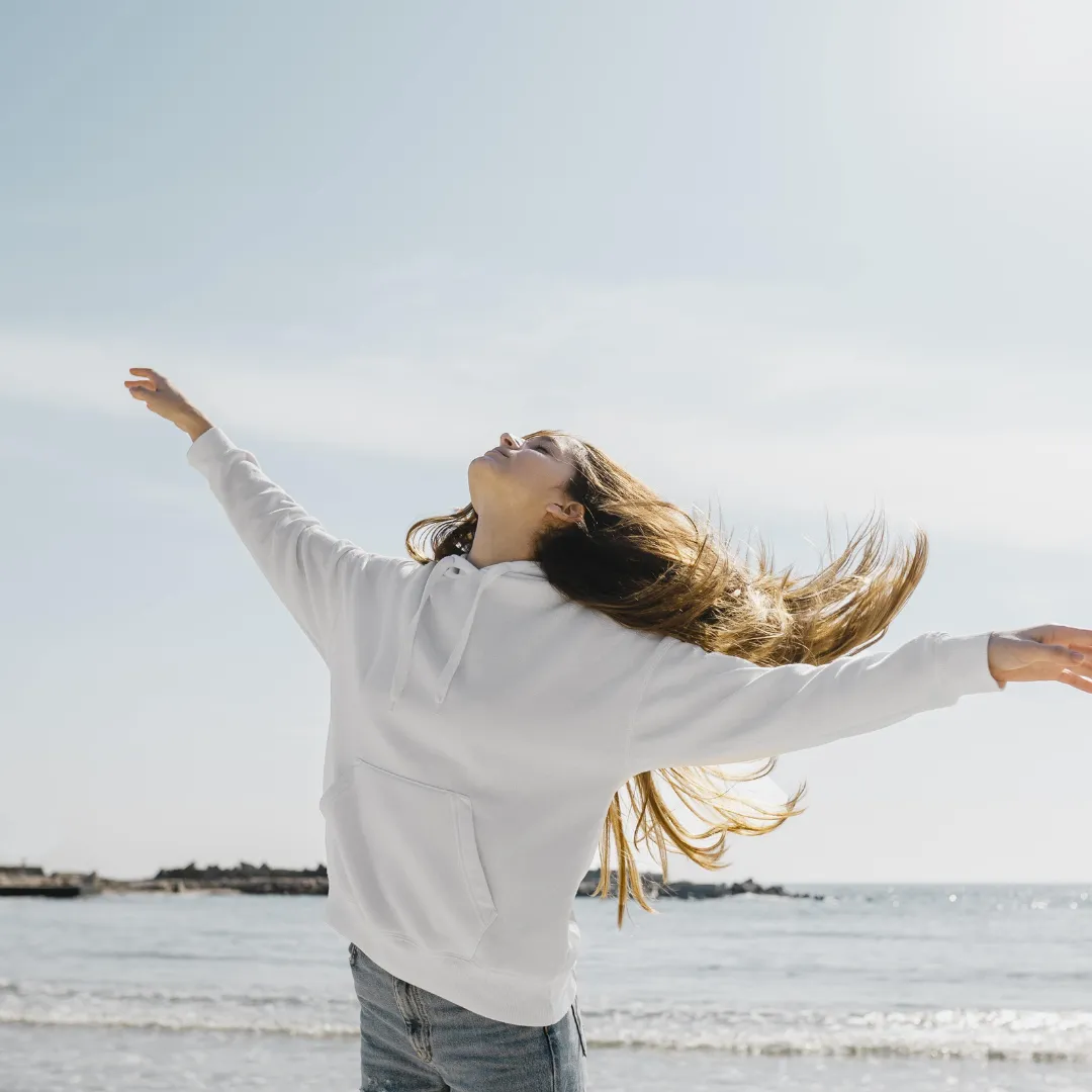lady dancing at waterside