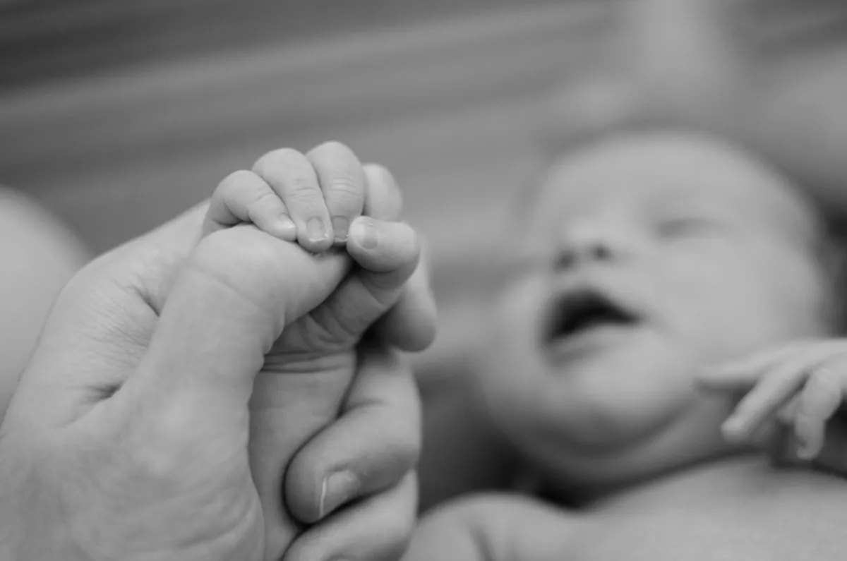 baby holding hand
