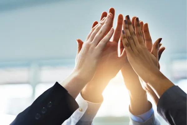 Group of people giving high-fives