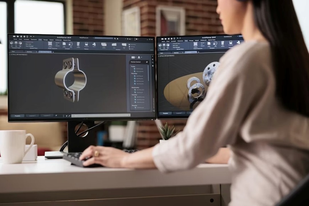 A woman working on her desktop, developing a 3D prototype