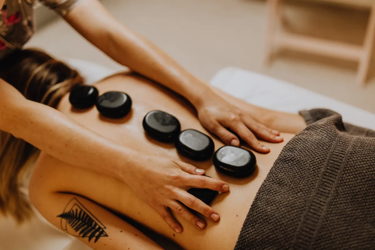 Cozy Kirkland massage room with soft lighting and decor, perfect for massage therapy for stress relief and relaxation.