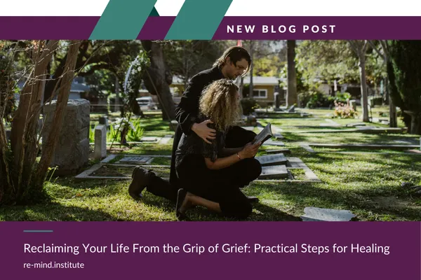 man and woman grieving in cemetery