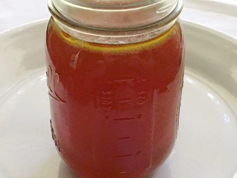 A glass jar of bone broth
