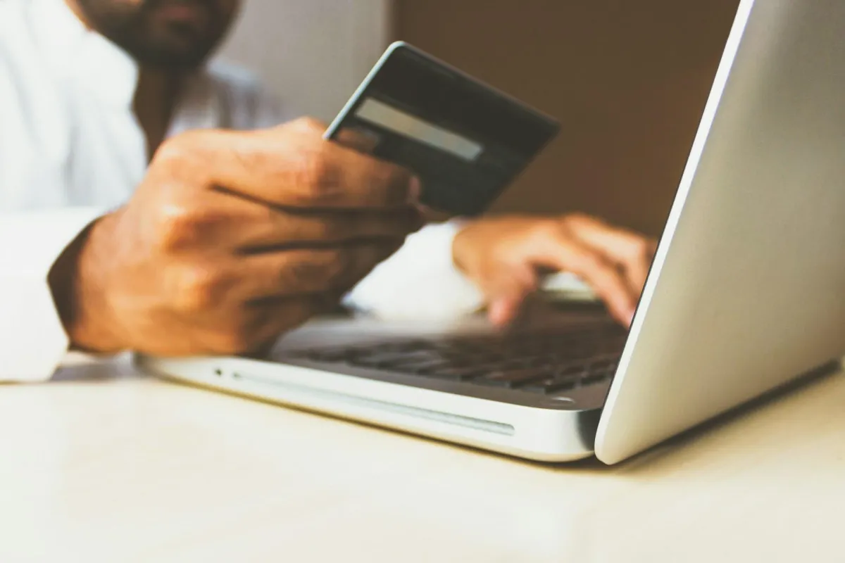 A man holding a credit card