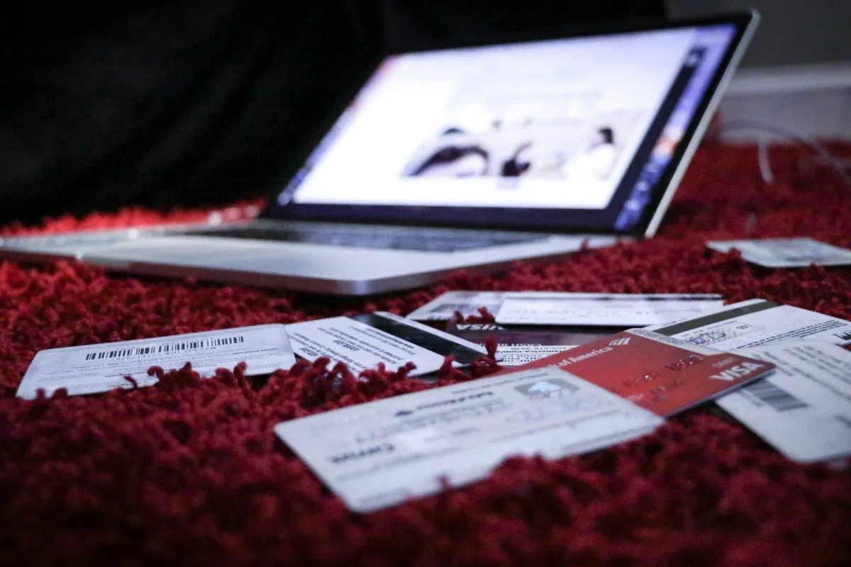 A laptop and a bunch of cards