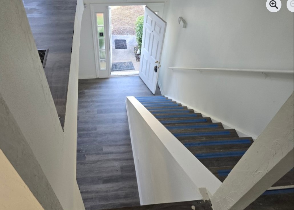 Before photo of interior bannister removed for custom architectural metal upgrade in Jacksonville Beach FL