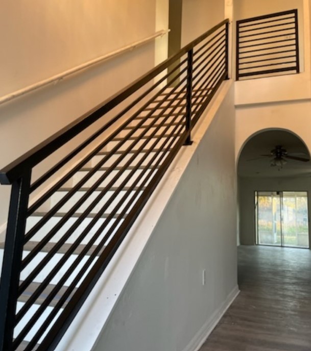 Custom steel stair railing installed inside a Jacksonville Beach Florida home by The Art of Steel LLC