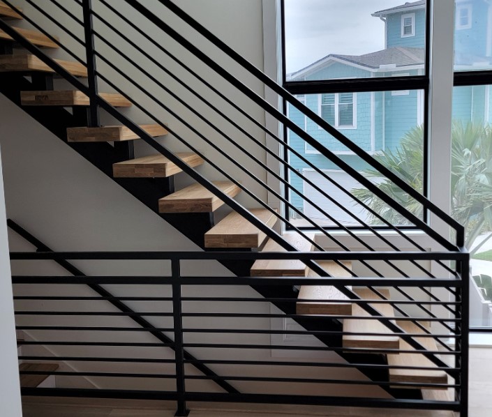Custom steel staircase and interior bannister system in three story Ponte Vedra Beach FL home