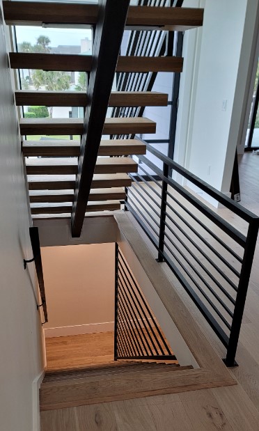 Interior view of custom welded staircase and bannisters spanning multiple floors in Ponte Vedra Beach FL
