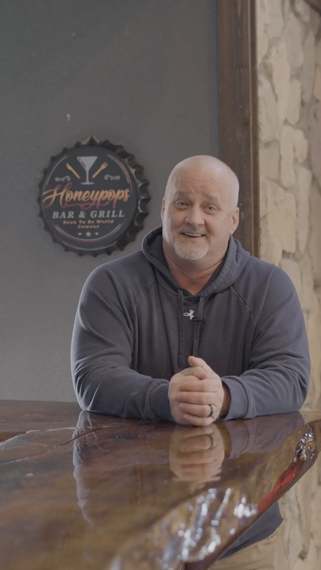 Spencer Dawdy, owner of Honeypop’s Bar and Grill in Anderson, Missouri, standing inside his restaurant for a client testimonial with Lemman Tax Accountant.
