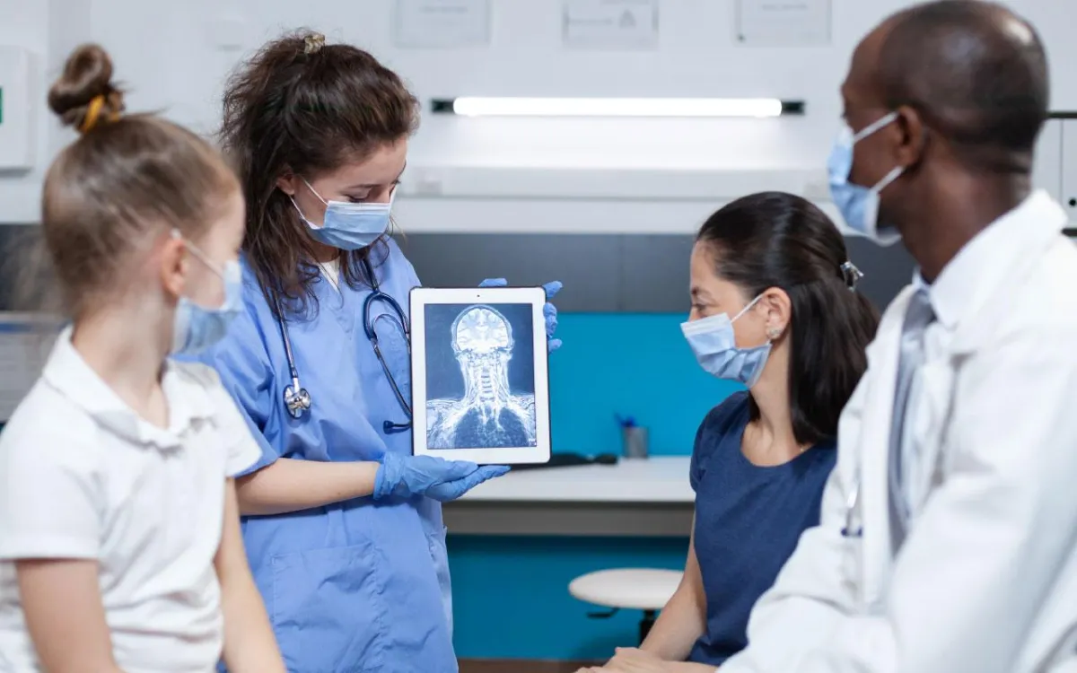 Doctors Parent Child looking at xray